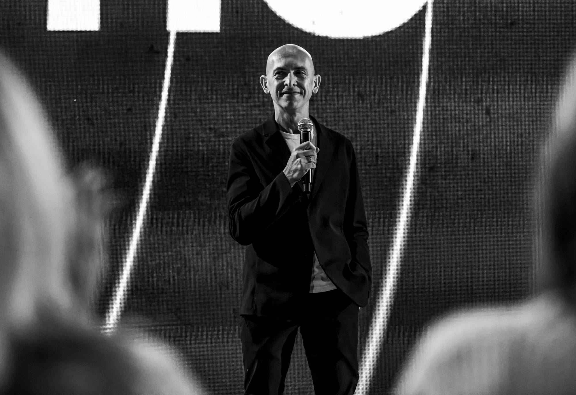 A speaker on stage in front of the LED wall